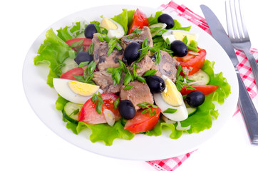 Obraz na płótnie Canvas Salad of fresh vegetables, egg, canned fish and olives. 