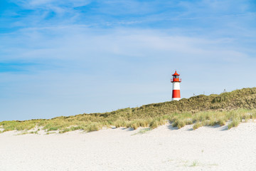 Lighthouse red white on dune. Sylt island – North Germany.  