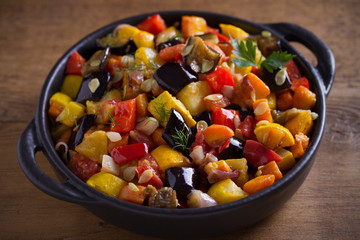 Vegetable stew: aubergines, paprika pepper, tomatoes, zucchini, carrots and onions. Stewed vegetable salad