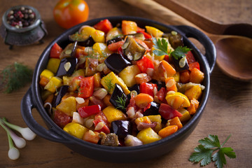 Vegetable stew: aubergines, paprika pepper, tomatoes, zucchini, carrots and onions. Stewed vegetable salad