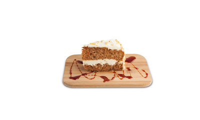 Carrot cake on a wooden board isolated on a white background