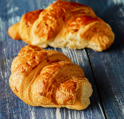 croissants on blue wooden background