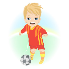 Happy little boy with ball playing football outdoor