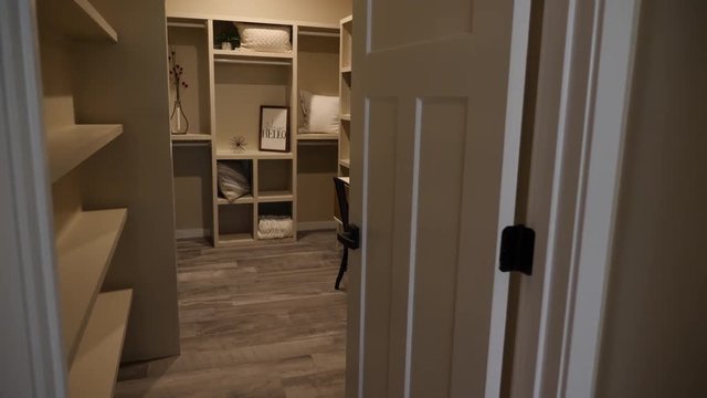 Walk Through Closet and Reveal Vanity Area. view moves through a walk-in closet and reveals a sitting area with vanity