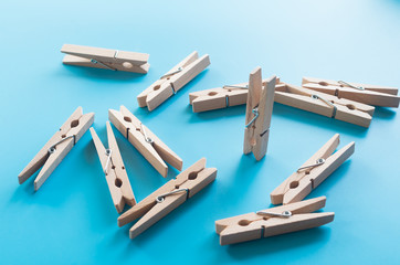 wooden clothespins on blue background