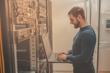 network engineer working in server room