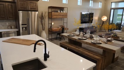 Walk Through Home from Kitchen to Outdoor Patio. view moves through a modern decorated home interior from kitchen through living room and outside to patio area - Powered by Adobe