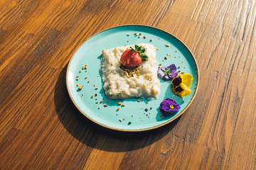Traditional Turkish Milk dessert Gullac or baklava dough on wooden table. This is also Ramadan dessert.