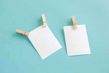 Blank portrait mock-up paper. brochure magazine isolated on blue, changeable background / white paper isolated on light blue paper.