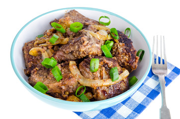 Fried liver with onions in bowl on white background.