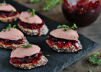Canapes snacks with chicken pate and onion marmalade (chutney)