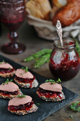 Canapes snacks with chicken pate and onion marmalade (chutney)