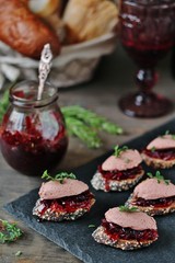 Canapes snacks with chicken pate and onion marmalade (chutney)