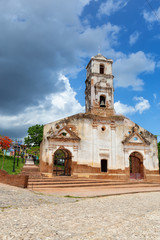 Fototapeta na wymiar Church in a small touristic Cuban Town during a vibrant sunny day. Taken in Trinidad, Cuba.