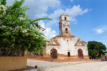 Fototapeta na wymiar Church in a small touristic Cuban Town during a vibrant sunny day. Taken in Trinidad, Cuba.