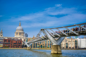 Fototapeta na wymiar London, United Kingdom - April 18, 2019 - St. Paul's Cathedral across Millennium Bridge and the River Thames in London, UK.