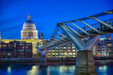 Fototapeta na wymiar St. Paul's Cathedral across Millennium Bridge and the River Thames in London, UK.