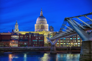 Fototapeta na wymiar St. Paul's Cathedral across Millennium Bridge and the River Thames in London, UK.