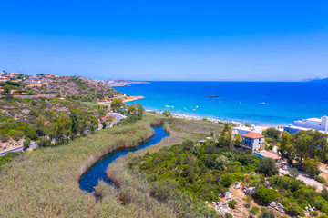 Famous sandy beach of Almyros and the river near Agios Nikolaos, Crete, Greece.