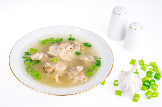 Broth with chicken meat Isolated on White background