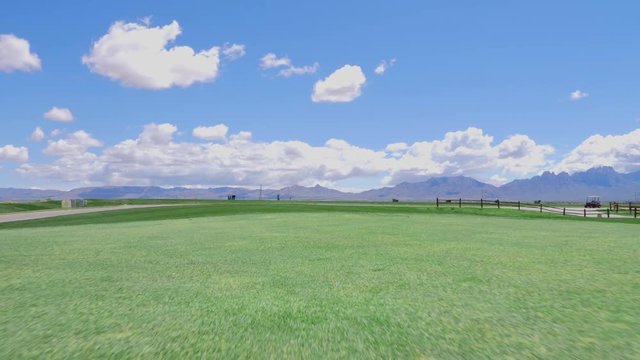 Follow Golf Ball Putt Into Hole. view follows low as a golf ball is hit by a putter and followed into hole