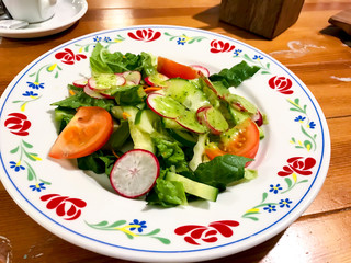 Fresh vegetable salad with green sauce. Photo