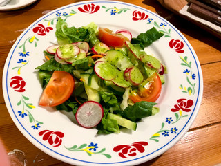 Fresh vegetable salad with green sauce. Photo