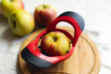 round apple slicer on a board, making eight segments for breakfast