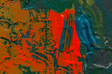 close up brushes with painting on dark black conctrete surface