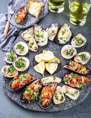 Seafood assorted platter Macha and mussels a la parmesana, mussels a la chalaca, clams with herb sauce