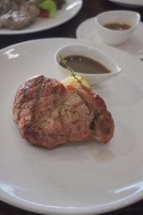 pork steak with mash potato on white plate