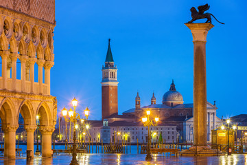 Fototapeta na wymiar Piazza San Marco at night, view on venetian lion and san giorgio maggiore, Vinice, Italy