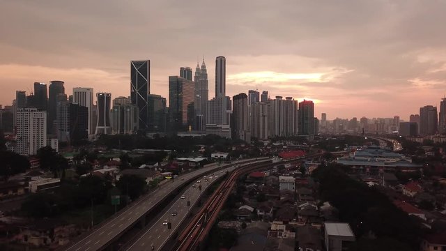 Kuala Lumpur, Malaysia - 1 July 2019: Aerial view of Kuala Lumpur city in Malaysia capital, tall buildings. Cinematic video of skyscrapers in big City.