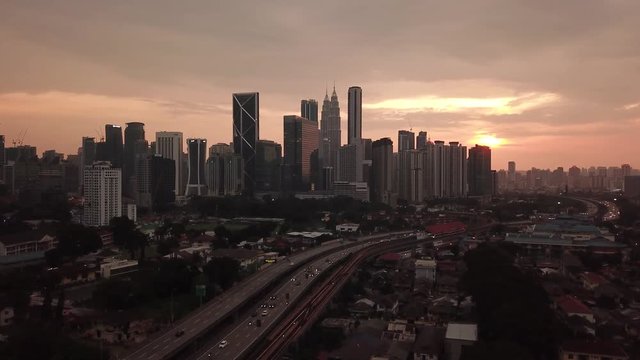 Kuala Lumpur, Malaysia - 1 July 2019: Aerial view of Kuala Lumpur city in Malaysia capital, tall buildings. Cinematic video of skyscrapers in big City.