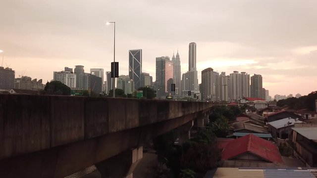 Kuala Lumpur, Malaysia - 1 July 2019: Aerial view of Kuala Lumpur city in Malaysia capital, tall buildings. Cinematic video of skyscrapers in big City.