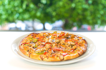 Delicious, tasty, fresh and italian chicken pizza. View chicken pizza in restaurant at napoli. Pizza on plate from top view.