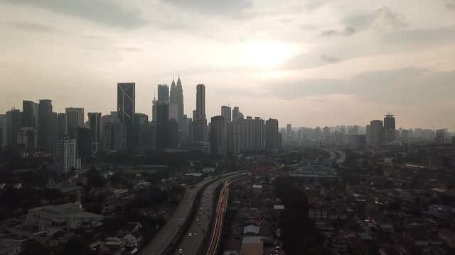 Kuala Lumpur, Malaysia - 1 July 2019: Aerial view of Kuala Lumpur city in Malaysia capital, tall buildings. Cinematic video of skyscrapers in big City.
