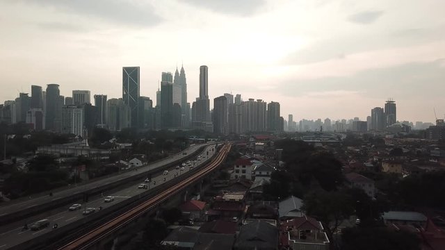Kuala Lumpur, Malaysia - 1 July 2019: Aerial view of Kuala Lumpur city in Malaysia capital, tall buildings. Cinematic video of skyscrapers in big City.