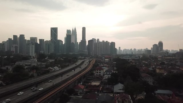 Kuala Lumpur, Malaysia - 1 July 2019: Aerial view of Kuala Lumpur city in Malaysia capital, tall buildings. Cinematic video of skyscrapers in big City.