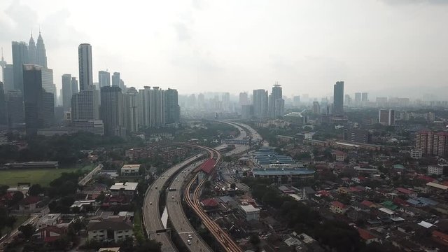 Kuala Lumpur, Malaysia - 1 July 2019: Aerial view of Kuala Lumpur city in Malaysia capital, tall buildings. Cinematic video of skyscrapers in big City.
