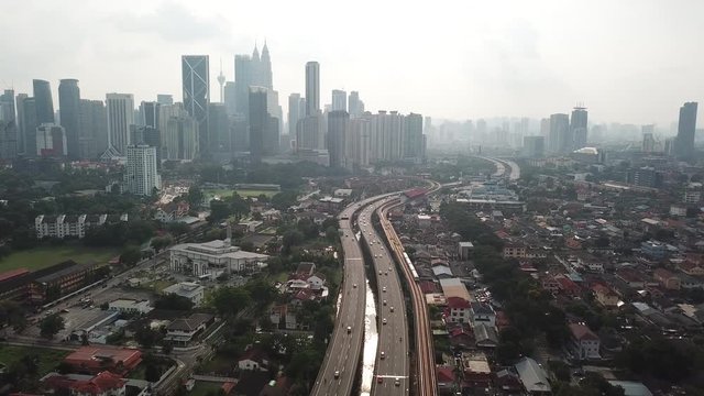 Kuala Lumpur, Malaysia - 1 July 2019: Aerial view of Kuala Lumpur city in Malaysia capital, tall buildings. Cinematic video of skyscrapers in big City.