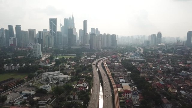 Kuala Lumpur, Malaysia - 1 July 2019: Aerial view of Kuala Lumpur city in Malaysia capital, tall buildings. Cinematic video of skyscrapers in big City.