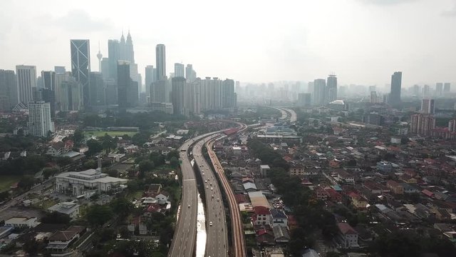 Kuala Lumpur, Malaysia - 1 July 2019: Aerial view of Kuala Lumpur city in Malaysia capital, tall buildings. Cinematic video of skyscrapers in big City.