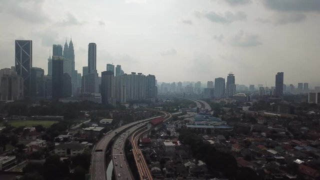 Kuala Lumpur, Malaysia - 1 July 2019: Aerial view of Kuala Lumpur city in Malaysia capital, tall buildings. Cinematic video of skyscrapers in big City.