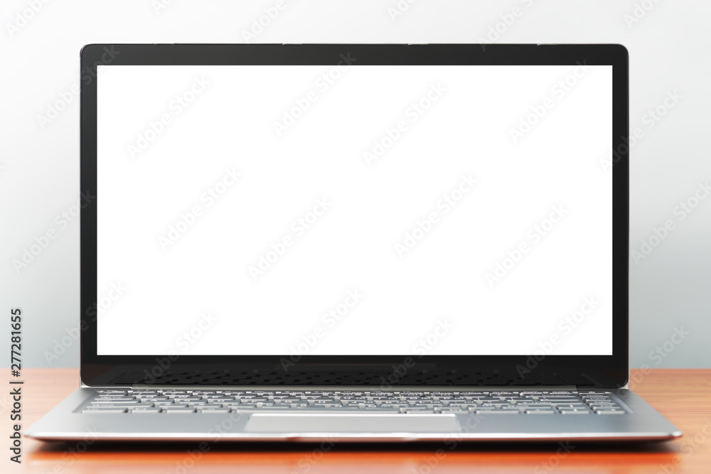 Poster laptop computer with white blank screen on wooden desk. front view image.