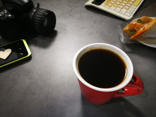 Obraz na płótnie Canvas Black coffee on the desk and Coffee Seeds