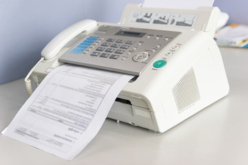 The fax machine for Sending documents in the office concept equipment needed in office - obrazy, fototapety, plakaty