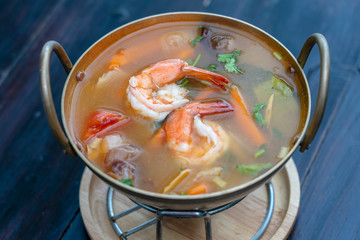Tom yam kung or Tom yum, Tom yam is a spicy clear soup typical in Thailand. Popular food in Thailand
