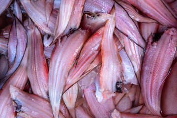 Red fish fillet at street market in Thailand. Seafood concept. Raw sea fish fillet for cooking, closeup