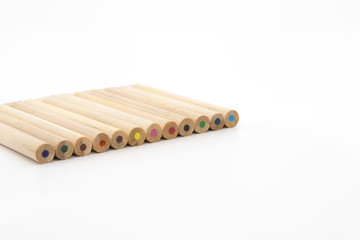 Solid color wood look colored pencil tail neatly placed on white background, pencil close-up